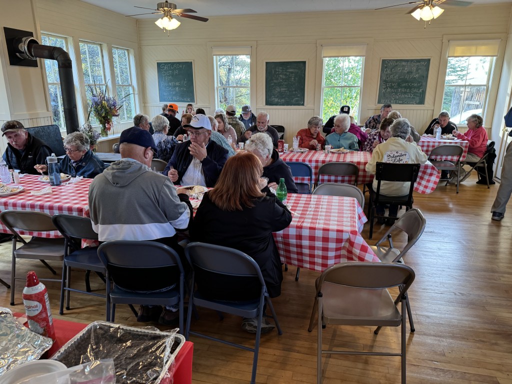 Community members enjoying a harvest supper.